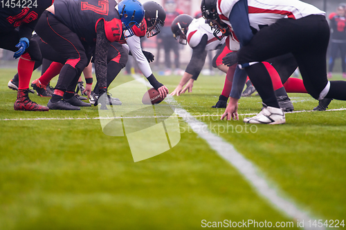 Image of professional american football players ready to start