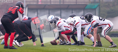 Image of professional american football players ready to start