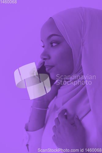 Image of african business woman using smartphone