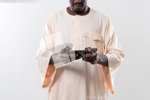 Image of african man using smartphone