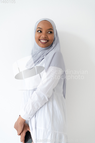 Image of african  woman using smartphone at home