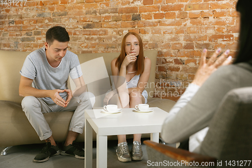 Image of Young couple at a consultation or appointment with a psychologist