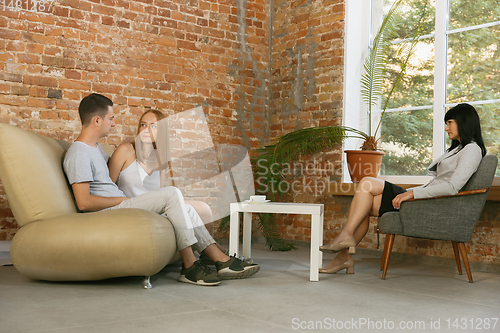 Image of Young couple at a consultation or appointment with a psychologist