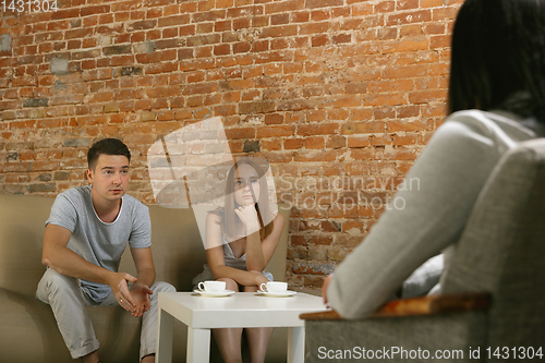 Image of Young couple at a consultation or appointment with a psychologist