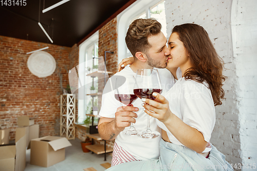 Image of Young couple moved to a new house or apartment