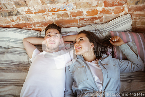 Image of Young couple moved to a new house or apartment