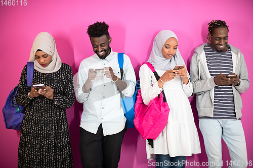 Image of african students group using smart phones