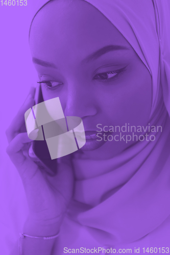 Image of african business woman using smartphone