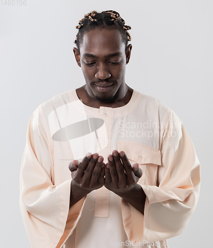 Image of african man pray to Allah