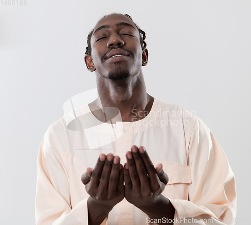 Image of african man pray to Allah