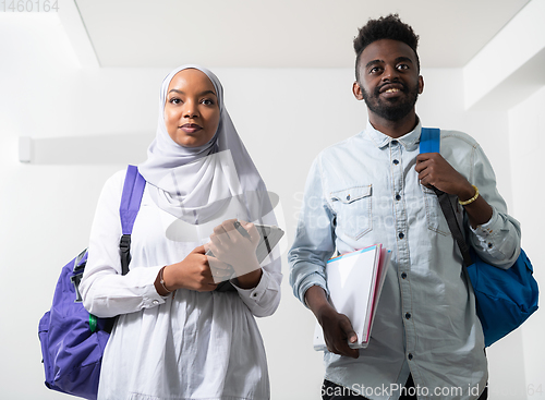 Image of african students couple walking