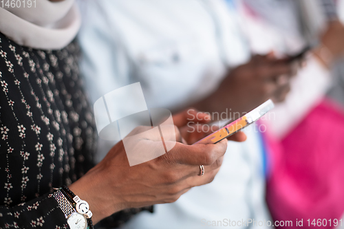 Image of african students group using smart phones