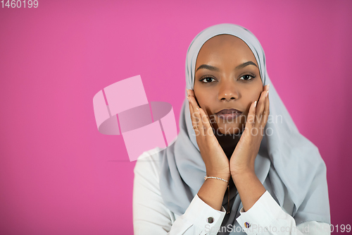 Image of African Muslim woman makes traditional prayer to God