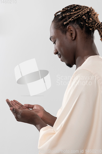 Image of african man pray to Allah