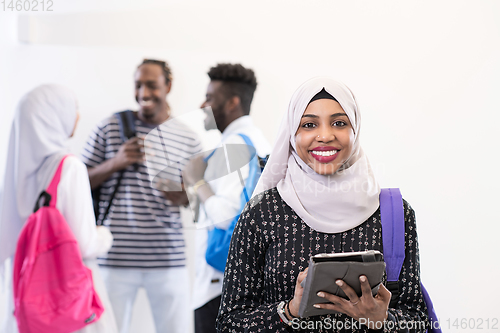 Image of african female student with group of friends