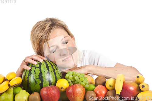 Image of Fruits and blond cute woman