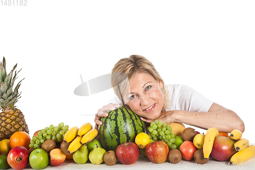 Image of Fruits and blond cute woman