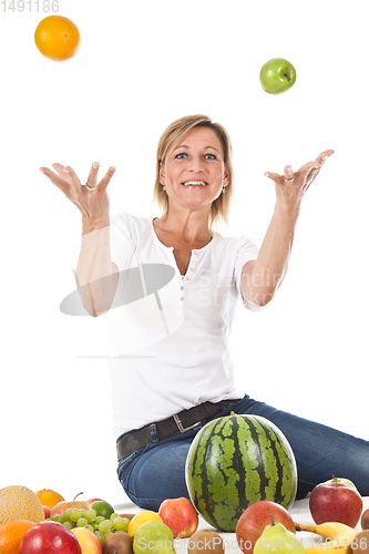 Image of Fruits and blond cute woman