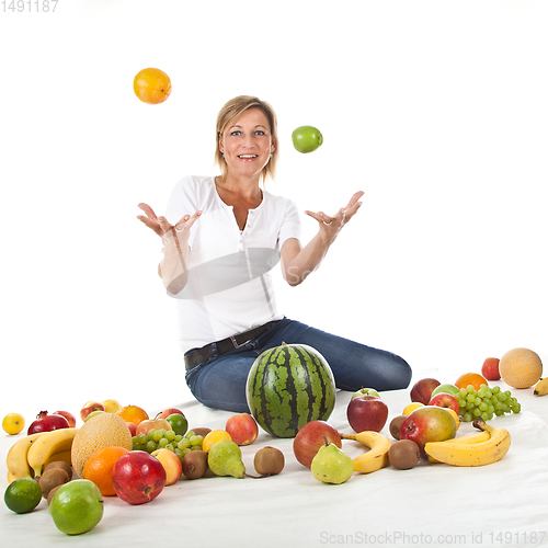 Image of Fruits and blond cute woman