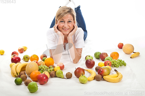 Image of Fruits and blond cute woman lying