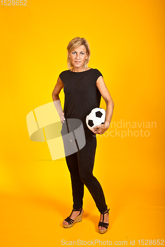 Image of woman posing with a soccer ball