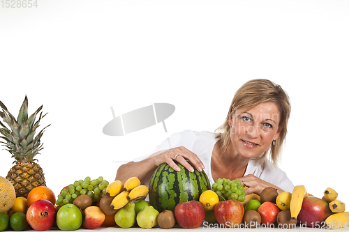 Image of Fruits and blond cute woman