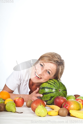 Image of Fruits and blond cute woman