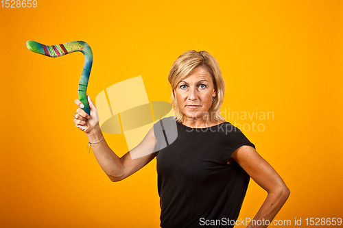 Image of woman posing with a boomerang