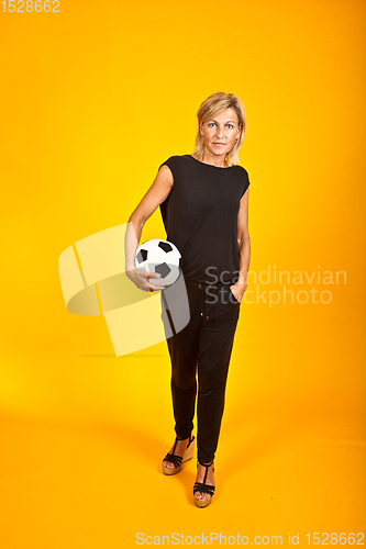 Image of woman posing with a soccer ball