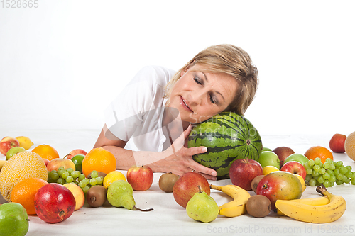 Image of Fruits and blond cute woman