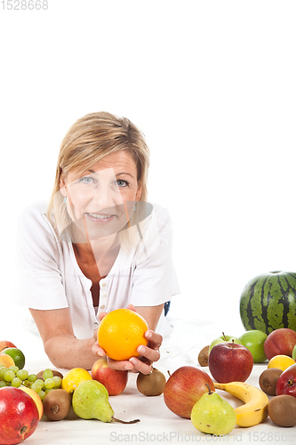 Image of Fruits and blond cute woman