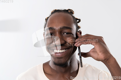 Image of african man using smartphone