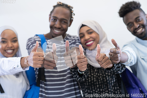 Image of african students group showing ok thumbs up