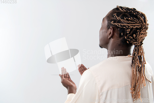 Image of african man pray to Allah