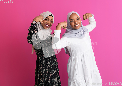 Image of afro beauty strenght CONCEPT WITH TWO GIRLS