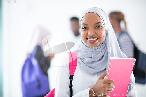 Image of african female student with group of friends