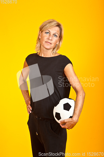 Image of woman posing with a soccer ball