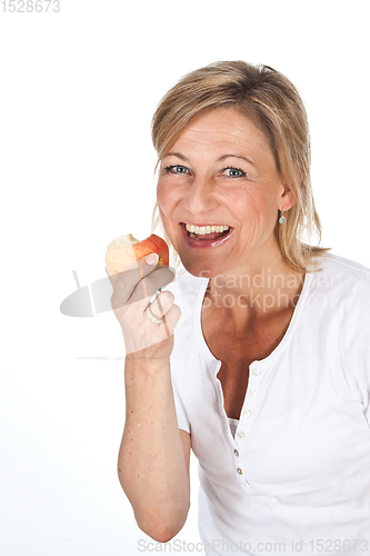 Image of Blond cute woman eating an apple