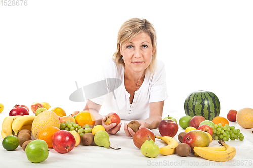 Image of Fruits and blond cute woman