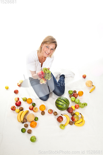 Image of Fruits and blond cute woman