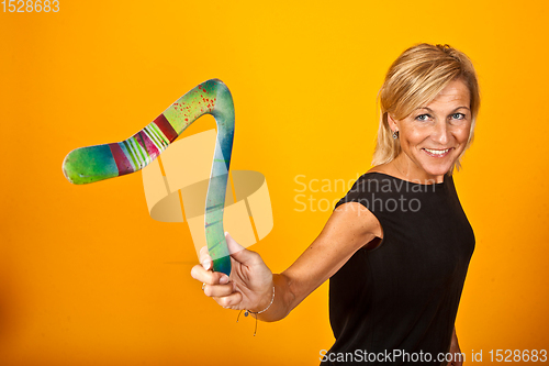 Image of woman posing with a boomerang