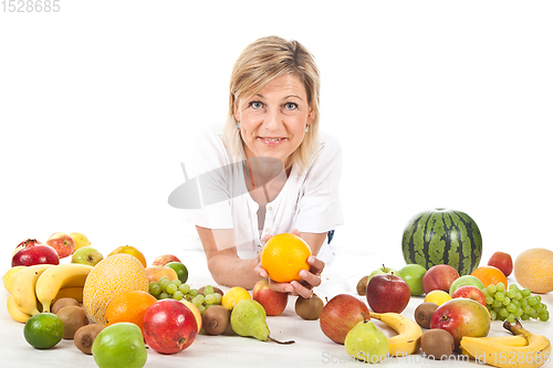 Image of Fruits and blond cute woman