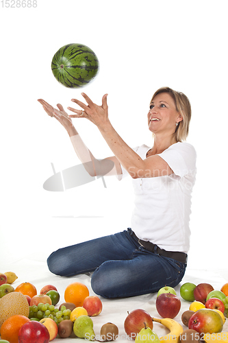 Image of Fruits and blond cute woman