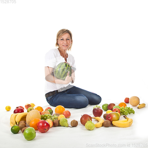 Image of Fruits and blond cute woman