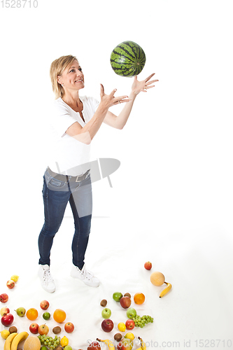 Image of Fruits and blond cute woman