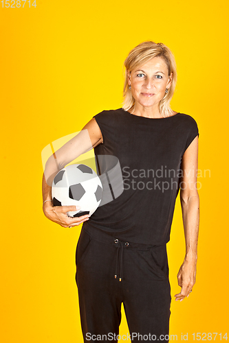 Image of woman posing with a soccer ball