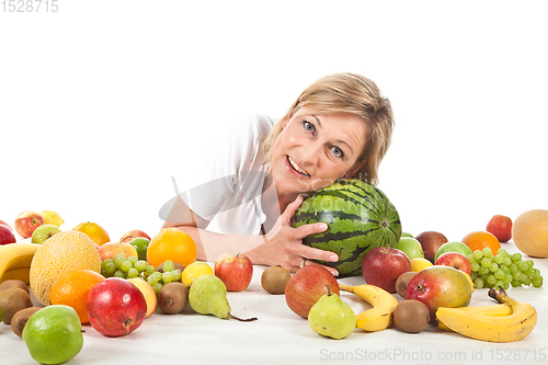 Image of Fruits and blond cute woman