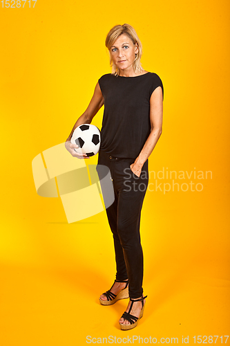 Image of woman posing with a soccer ball