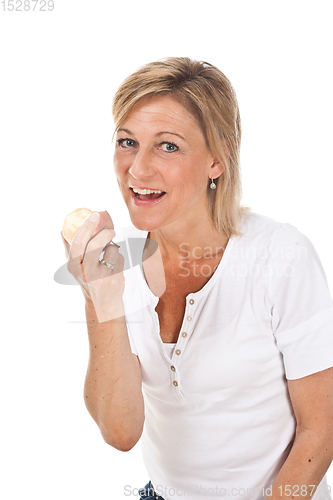 Image of Blond cute woman eating an apple