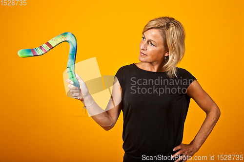 Image of woman posing with a boomerang